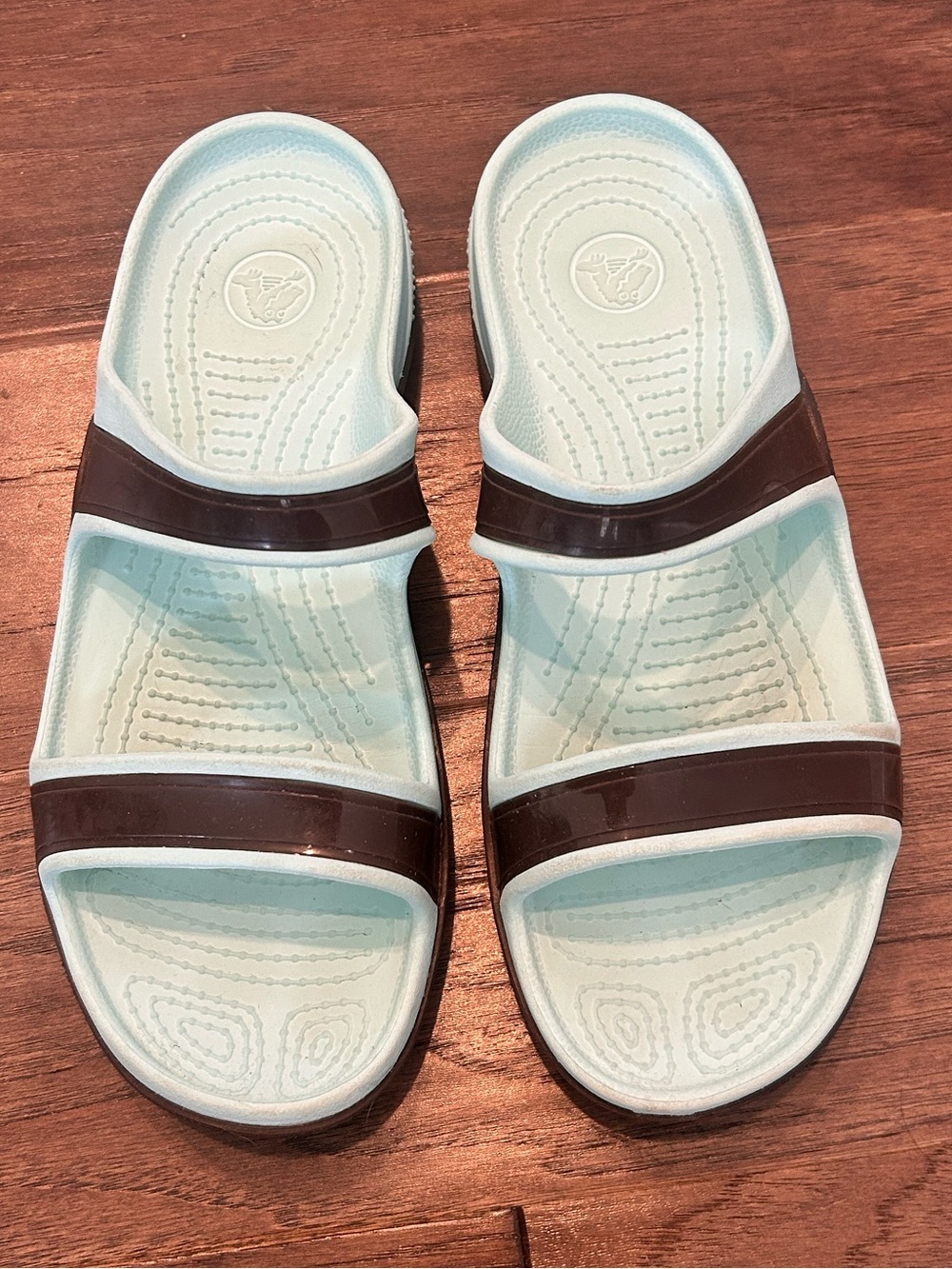 Crocs Women’s Light Blue/teal  Slide Sandals with Brown Straps. Size 9